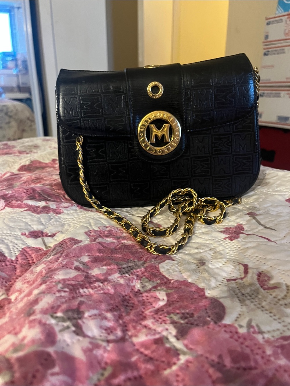 Metrocity Black Crossbody with Gold Medallion Accent